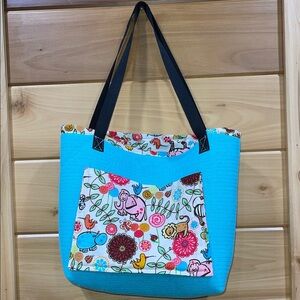 Vibrant Blue Lined Tote Bag with Patterned Pocket
